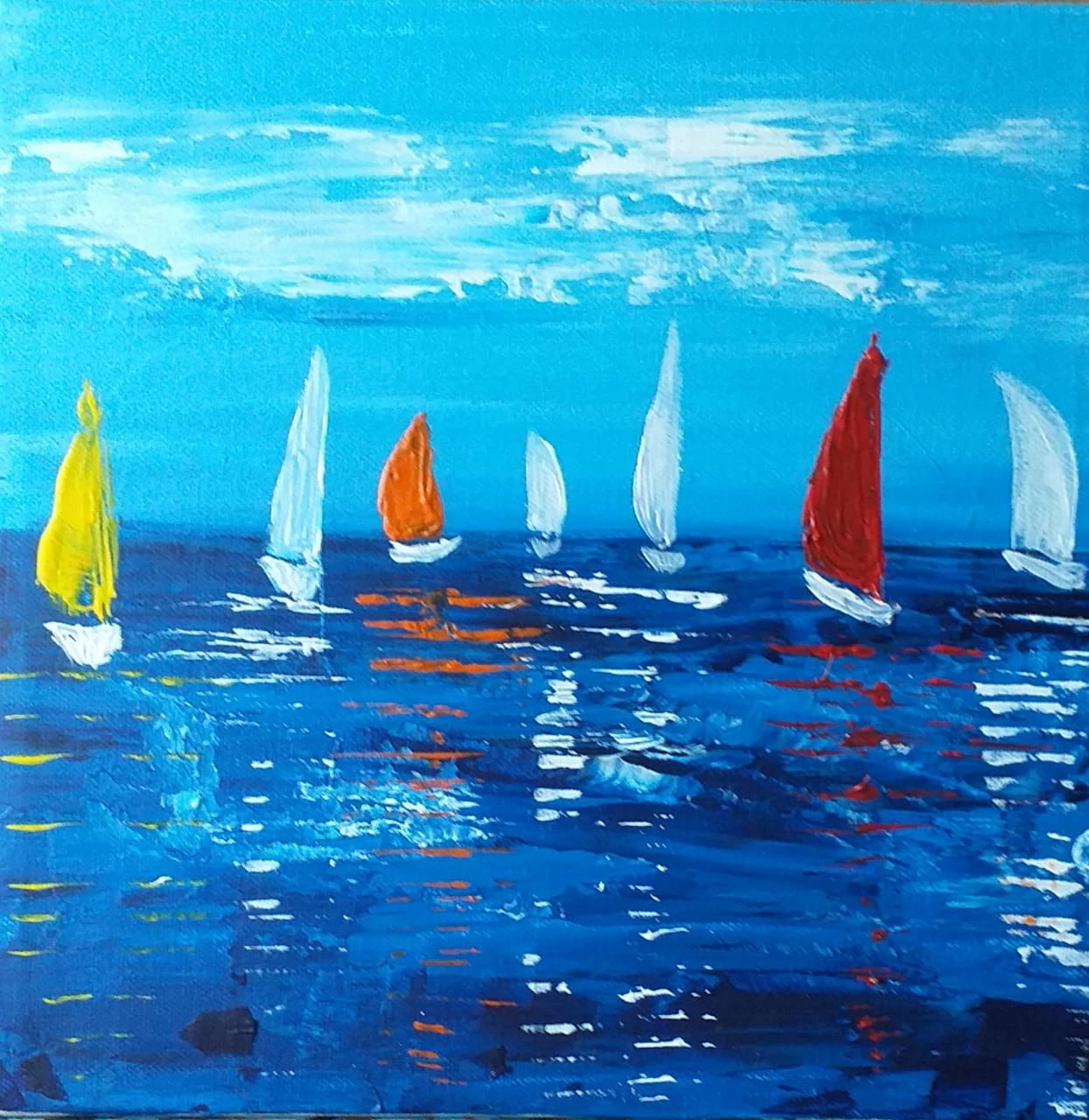 Abstract acrylic seascape of sailboats with red, orange and yellow sails on deep blue water.